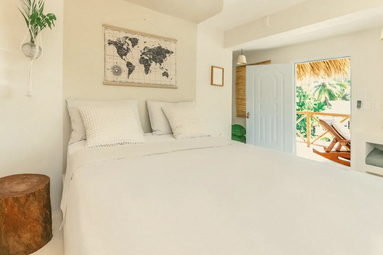 A bedroom opening onto a balcony