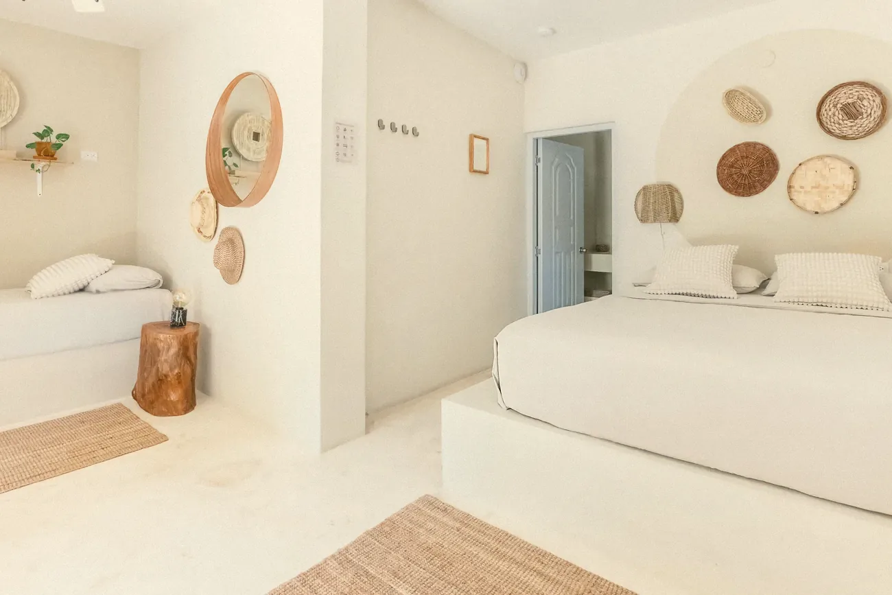 A bedroom with a double and a single bed