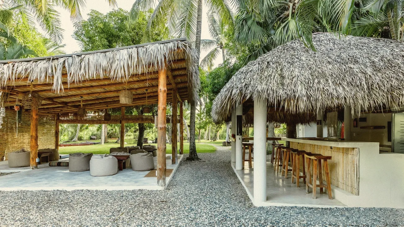 The garden lounge and bar under thatched roofs